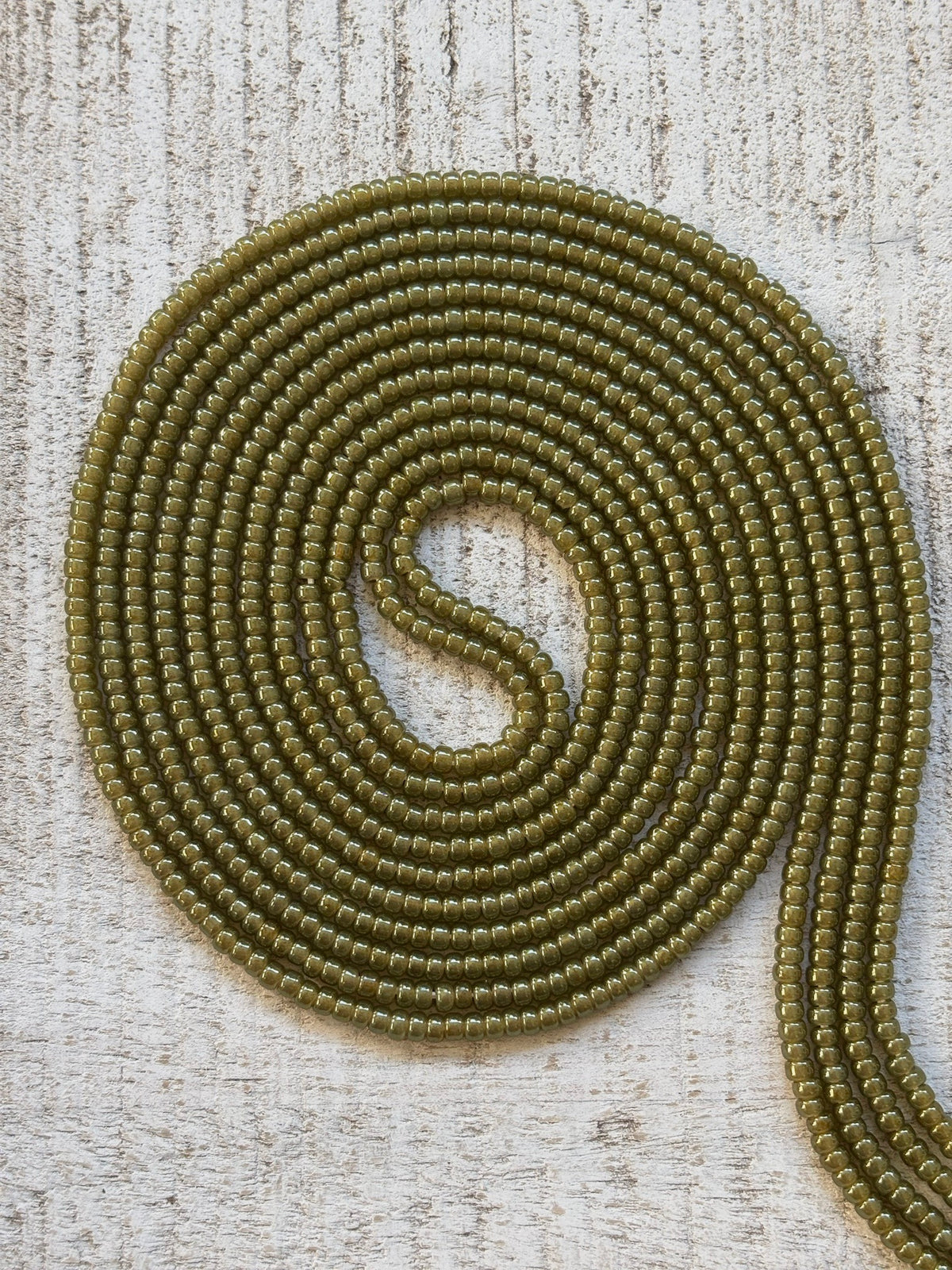 Peridot olive green waist bead strand close-up