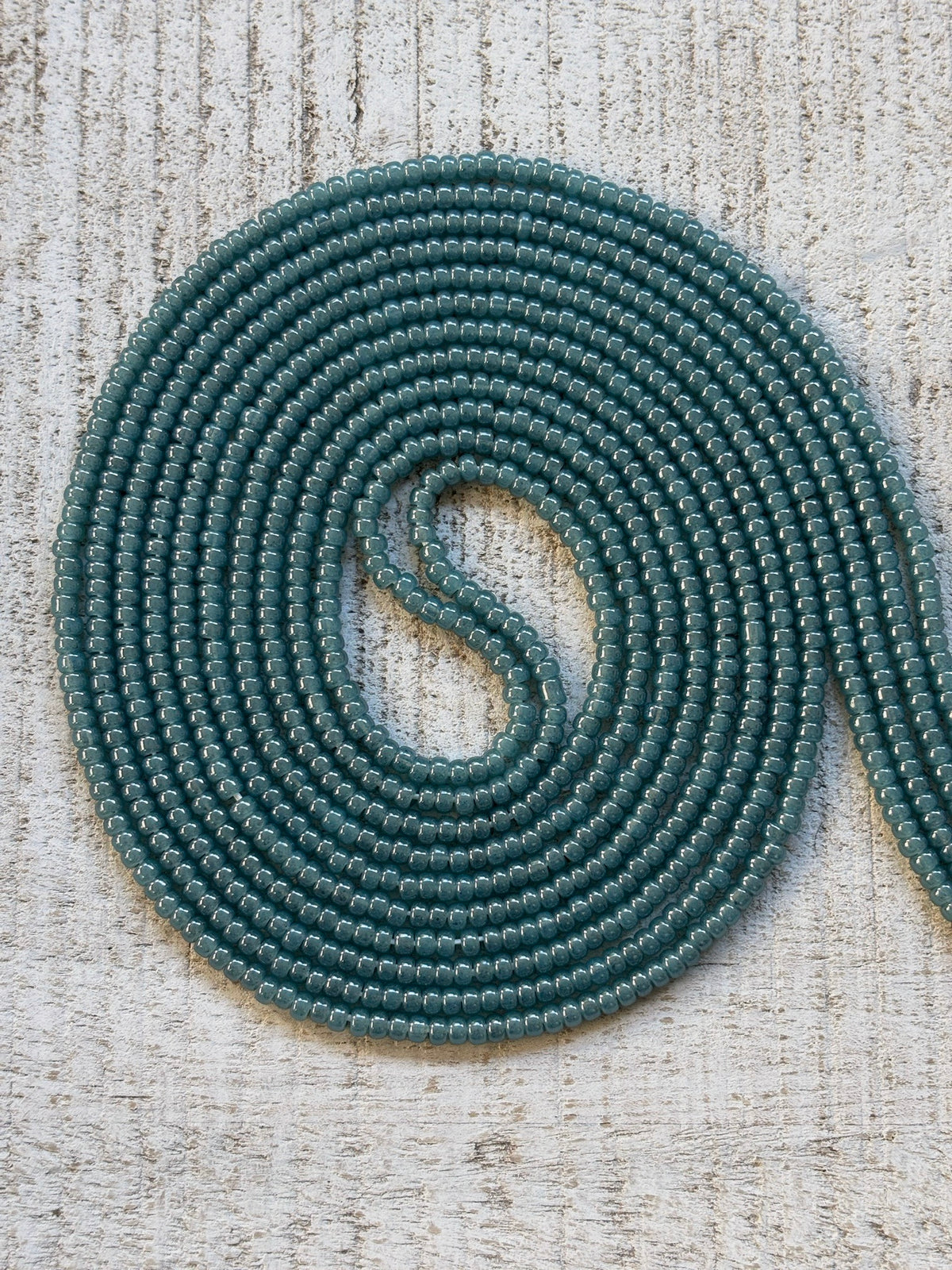 Tourmaline teal blue waist bead strand close-up