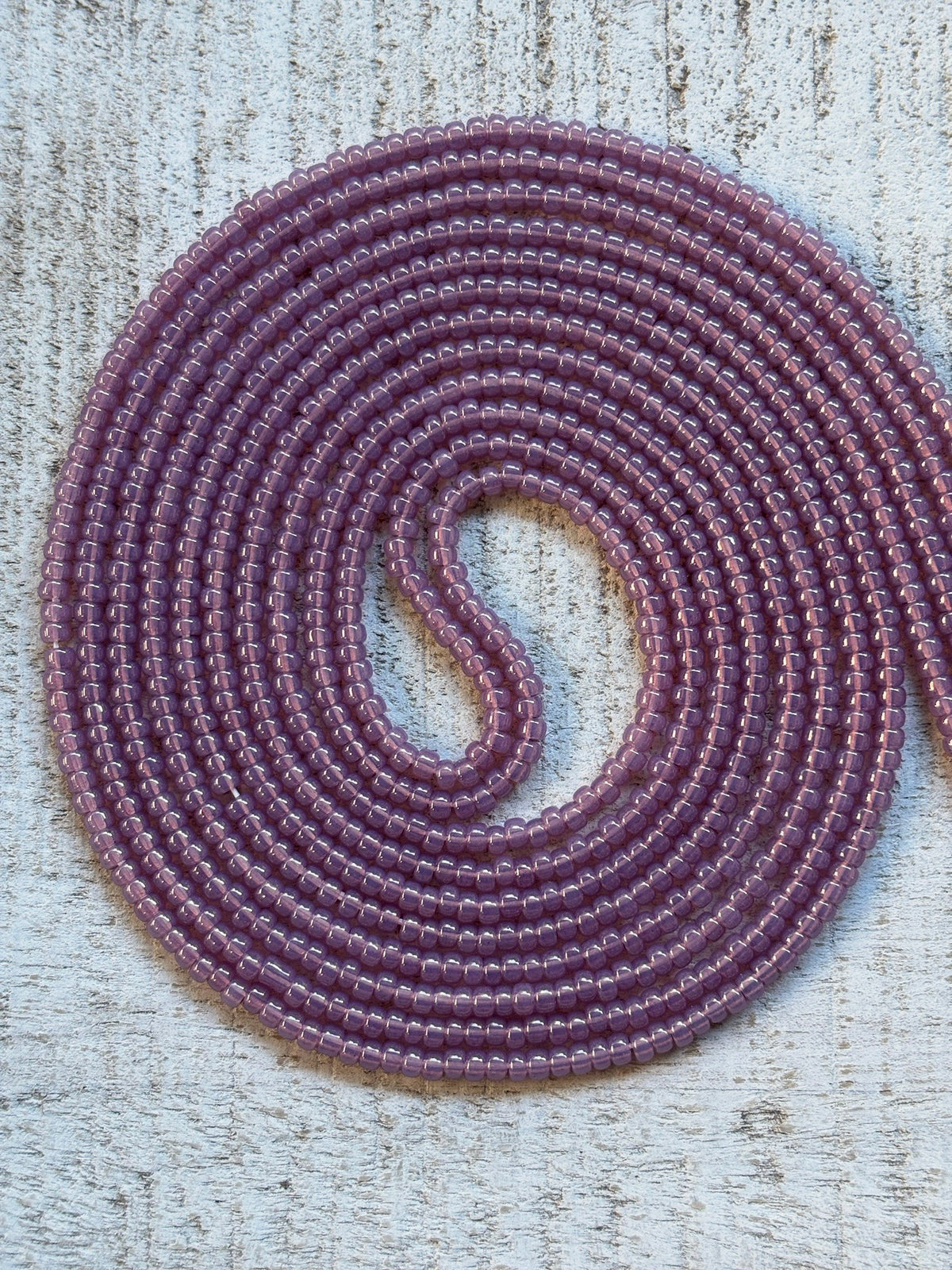 Opal lilac waist bead strand close-up
